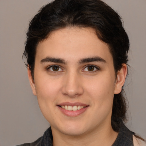 Joyful white young-adult female with medium  brown hair and brown eyes