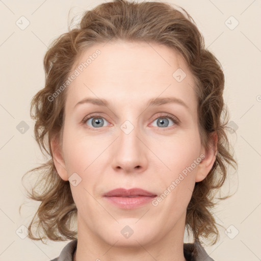 Joyful white young-adult female with medium  brown hair and blue eyes