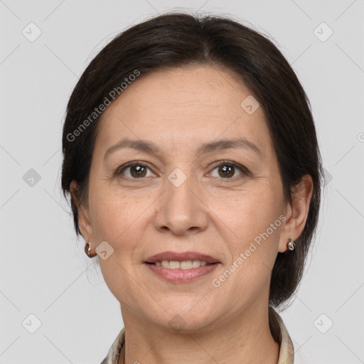 Joyful white adult female with medium  brown hair and brown eyes