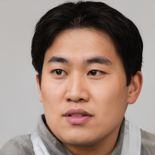 Neutral asian young-adult male with short  black hair and brown eyes