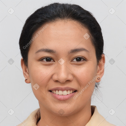 Joyful asian young-adult female with short  brown hair and brown eyes