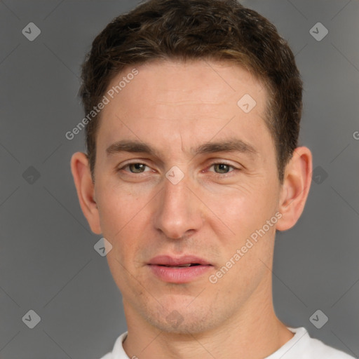 Joyful white adult male with short  brown hair and grey eyes