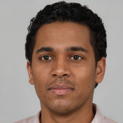 Neutral black young-adult male with short  black hair and brown eyes