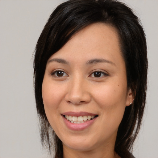 Joyful white young-adult female with medium  brown hair and brown eyes