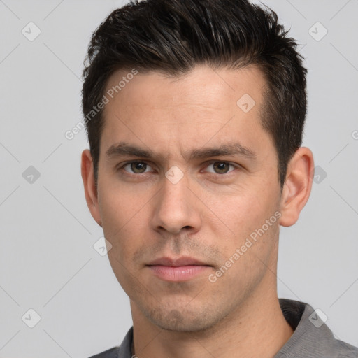 Neutral white adult male with short  brown hair and brown eyes