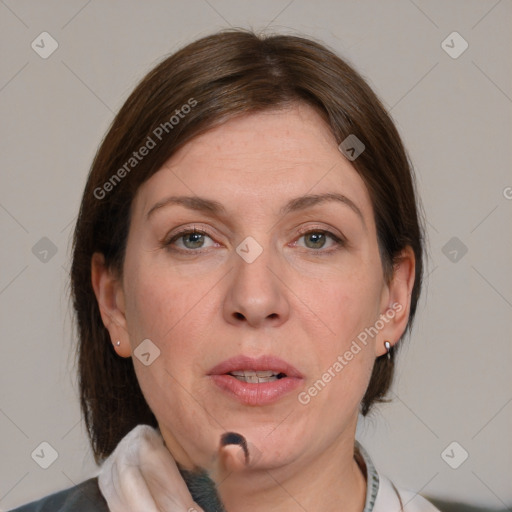 Joyful white adult female with medium  brown hair and blue eyes