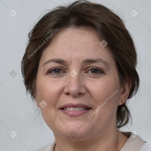 Joyful white adult female with medium  brown hair and brown eyes