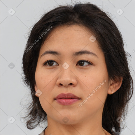 Joyful asian young-adult female with medium  brown hair and brown eyes