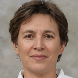 Joyful white adult female with short  brown hair and brown eyes