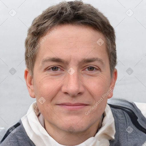 Joyful white adult male with short  brown hair and grey eyes