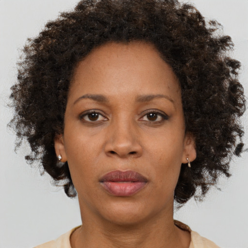 Neutral black adult female with short  brown hair and brown eyes