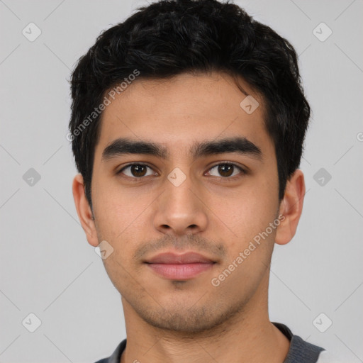 Neutral latino young-adult male with short  black hair and brown eyes