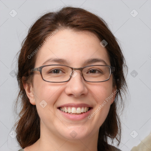 Joyful white adult female with medium  brown hair and grey eyes