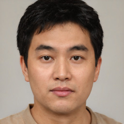 Neutral asian young-adult male with short  black hair and brown eyes