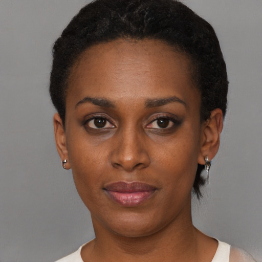 Neutral black young-adult female with short  black hair and brown eyes