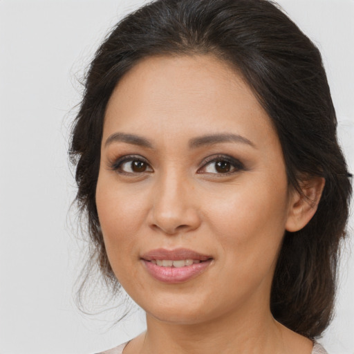 Joyful asian young-adult female with medium  brown hair and brown eyes