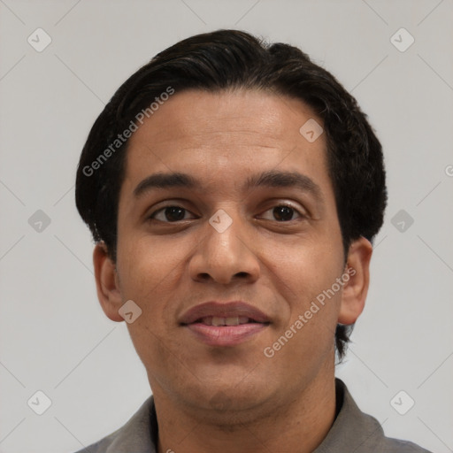 Joyful latino adult male with short  black hair and brown eyes