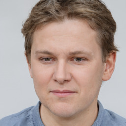 Joyful white adult male with short  brown hair and grey eyes