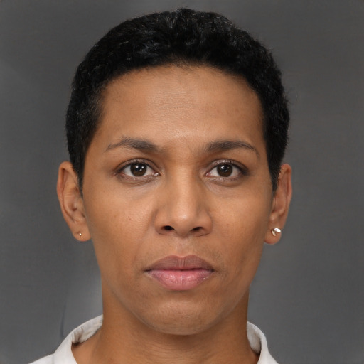 Joyful black young-adult female with short  black hair and brown eyes