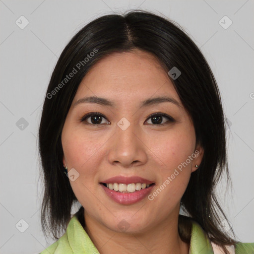 Joyful asian young-adult female with medium  brown hair and brown eyes