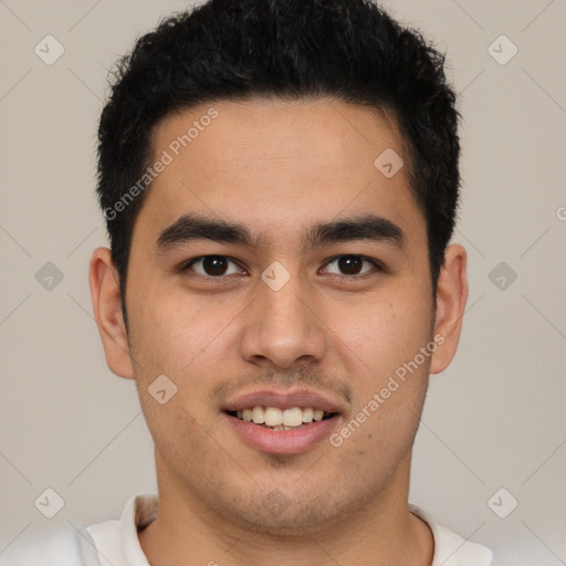 Joyful latino young-adult male with short  brown hair and brown eyes