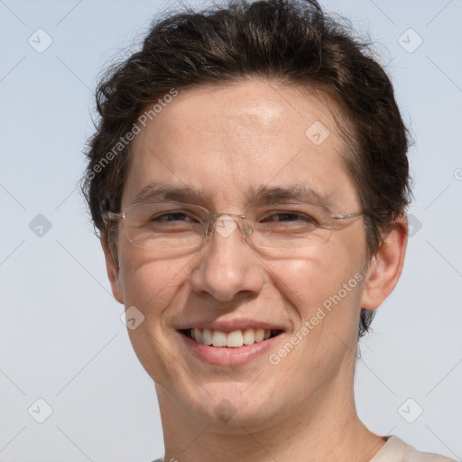 Joyful white adult male with short  brown hair and grey eyes