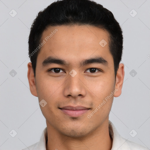 Joyful asian young-adult male with short  black hair and brown eyes