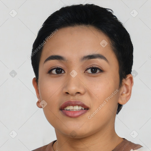 Joyful asian young-adult female with short  black hair and brown eyes