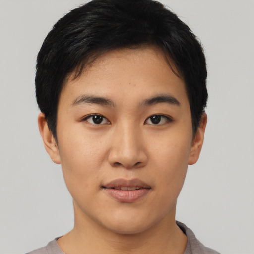 Joyful asian young-adult female with short  black hair and brown eyes