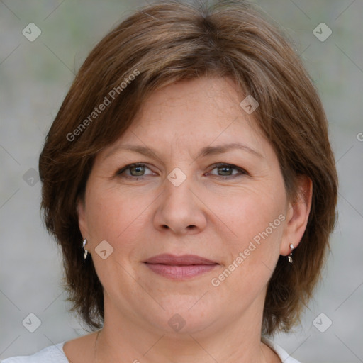 Joyful white adult female with medium  brown hair and green eyes