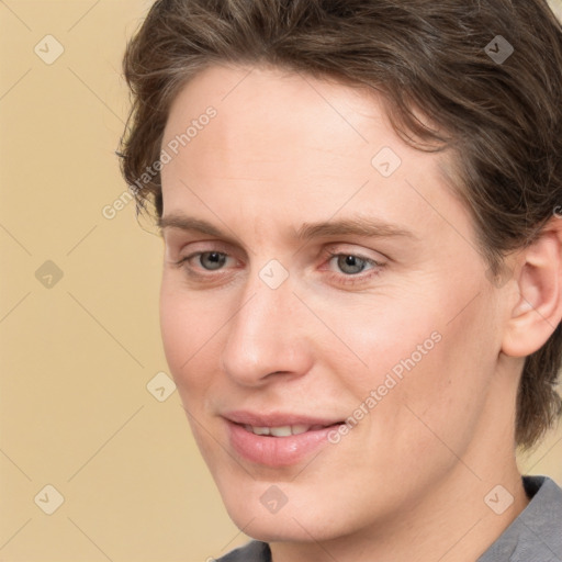 Joyful white adult female with short  brown hair and brown eyes