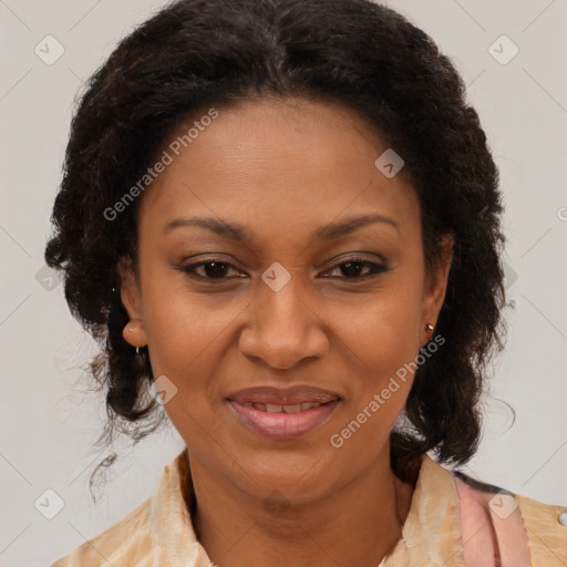 Joyful black adult female with medium  brown hair and brown eyes