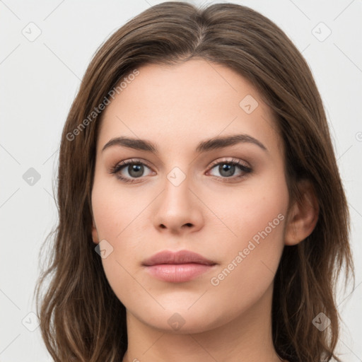 Neutral white young-adult female with long  brown hair and brown eyes