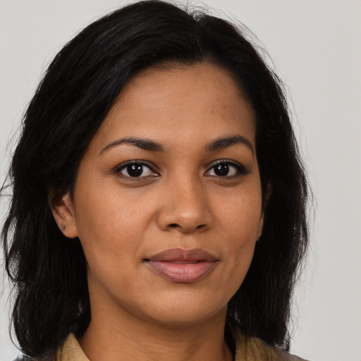 Joyful asian young-adult female with long  brown hair and brown eyes