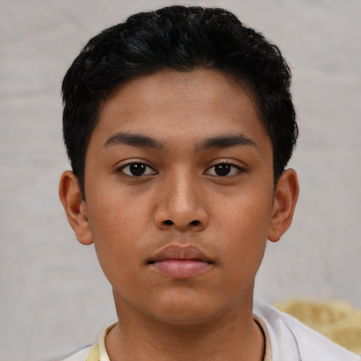 Neutral latino young-adult male with short  black hair and brown eyes