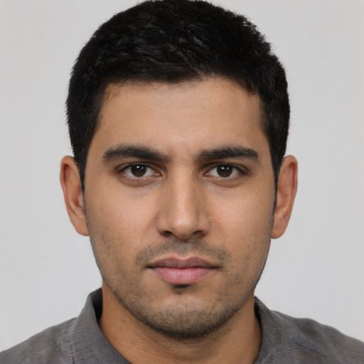 Neutral latino young-adult male with short  black hair and brown eyes