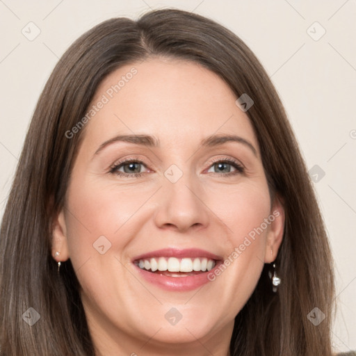 Joyful white adult female with long  brown hair and brown eyes