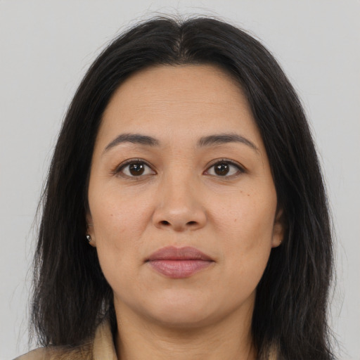 Joyful asian young-adult female with long  brown hair and brown eyes
