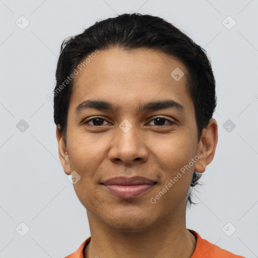 Joyful latino young-adult male with short  black hair and brown eyes