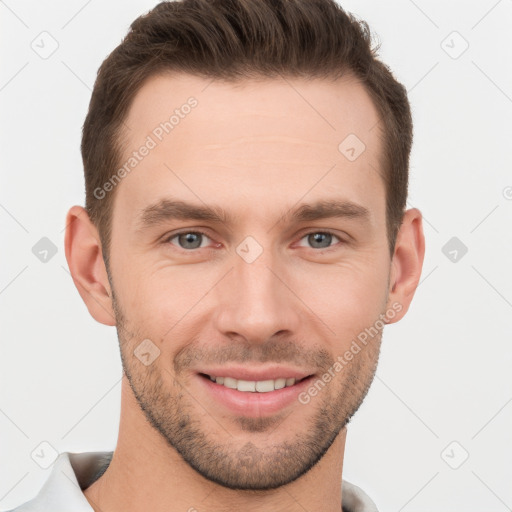 Joyful white young-adult male with short  brown hair and grey eyes