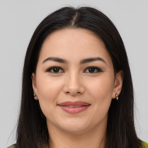 Joyful latino young-adult female with long  brown hair and brown eyes