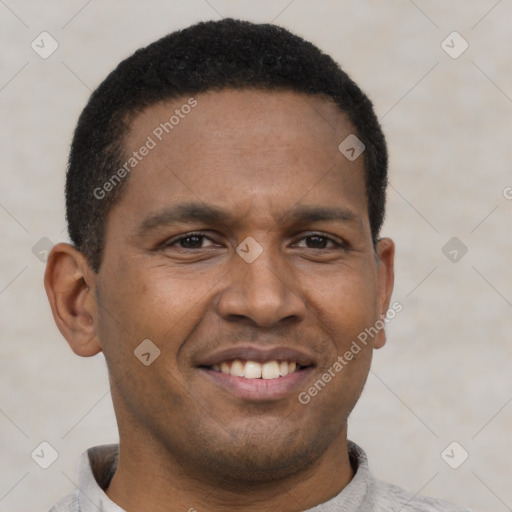 Joyful latino young-adult male with short  brown hair and brown eyes