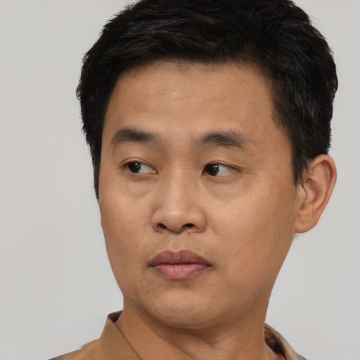 Neutral asian young-adult male with short  black hair and brown eyes