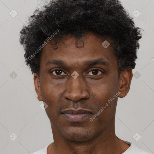 Neutral black adult male with short  black hair and brown eyes