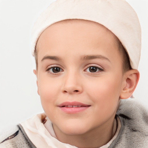 Joyful white child female with short  brown hair and brown eyes