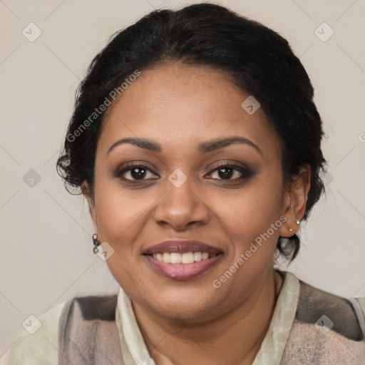 Joyful black adult female with medium  brown hair and brown eyes