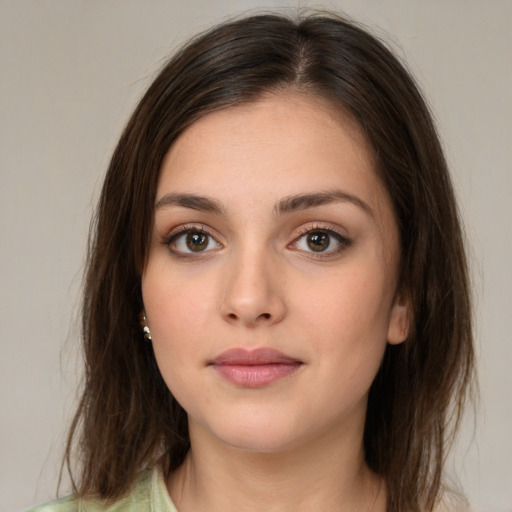 Neutral white young-adult female with medium  brown hair and green eyes