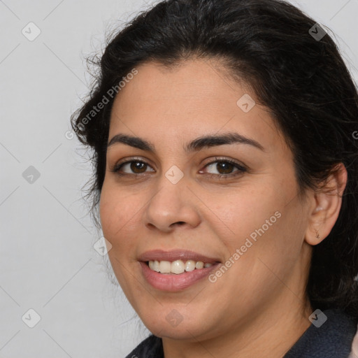 Joyful white young-adult female with long  brown hair and brown eyes