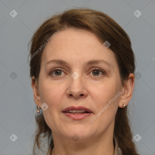 Joyful white adult female with medium  brown hair and grey eyes