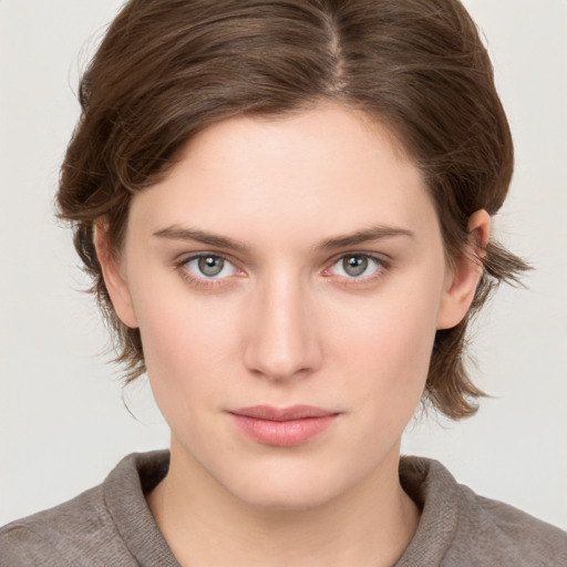 Neutral white young-adult female with medium  brown hair and grey eyes